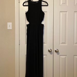 Black jumpsuit with side cutouts.